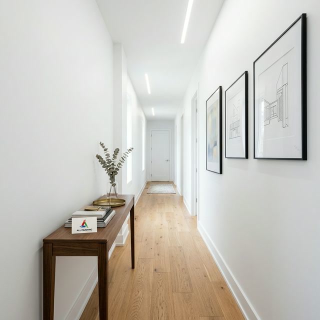 Dark navy accent wall in small Toronto condo bedroom creates visual depth