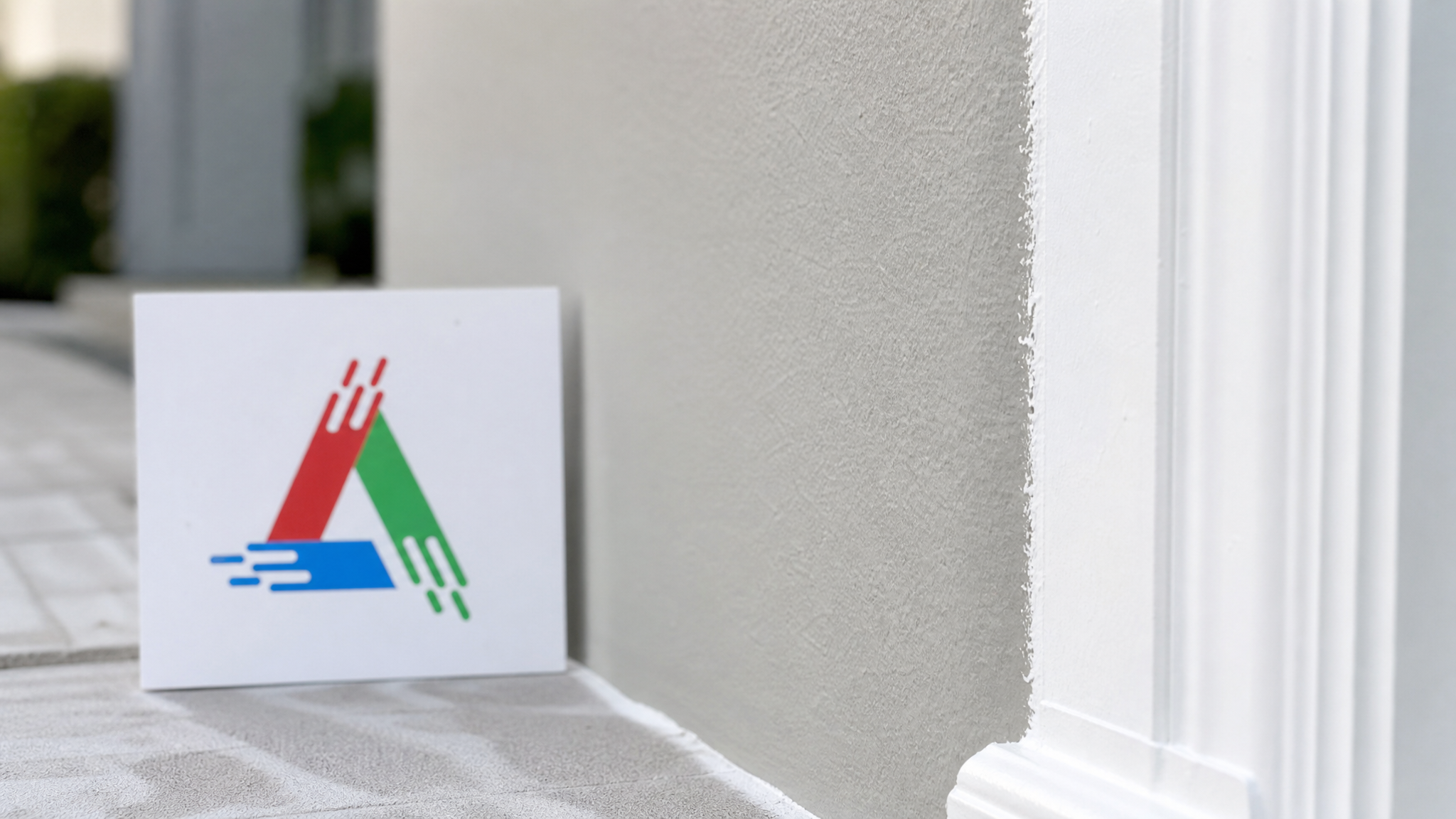 Close-up of a crisp cut-in line where a formerly dark wall meets white trim showing smooth even topcoat coverage with a small All Painting sign nearby