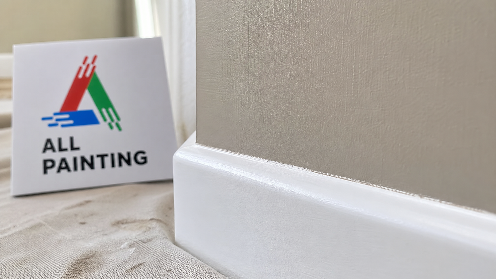 Close-up of a crisp painted cut-in line where a warm wall colour meets bright white trim in a Markham home