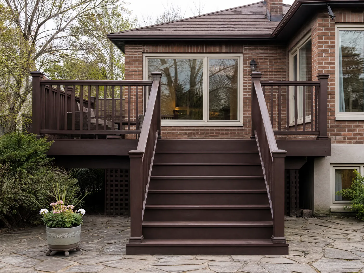 Deck stairs and railing freshly stained solid dark brown