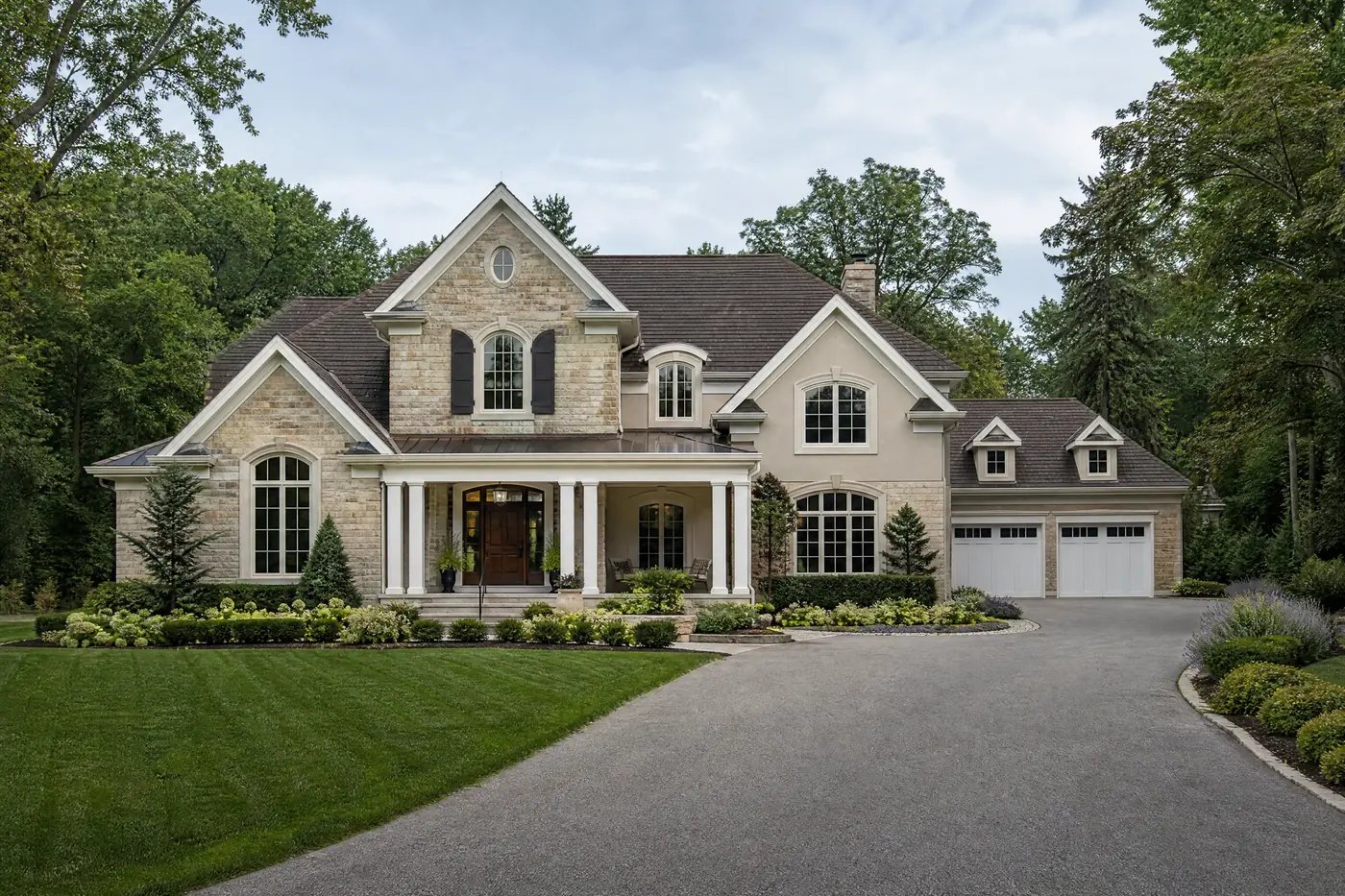 Country estate home with freshly painted white trim and columns