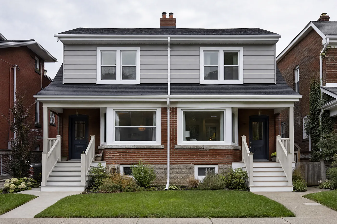 Semi-detached pair with freshly painted aluminum siding upstairs