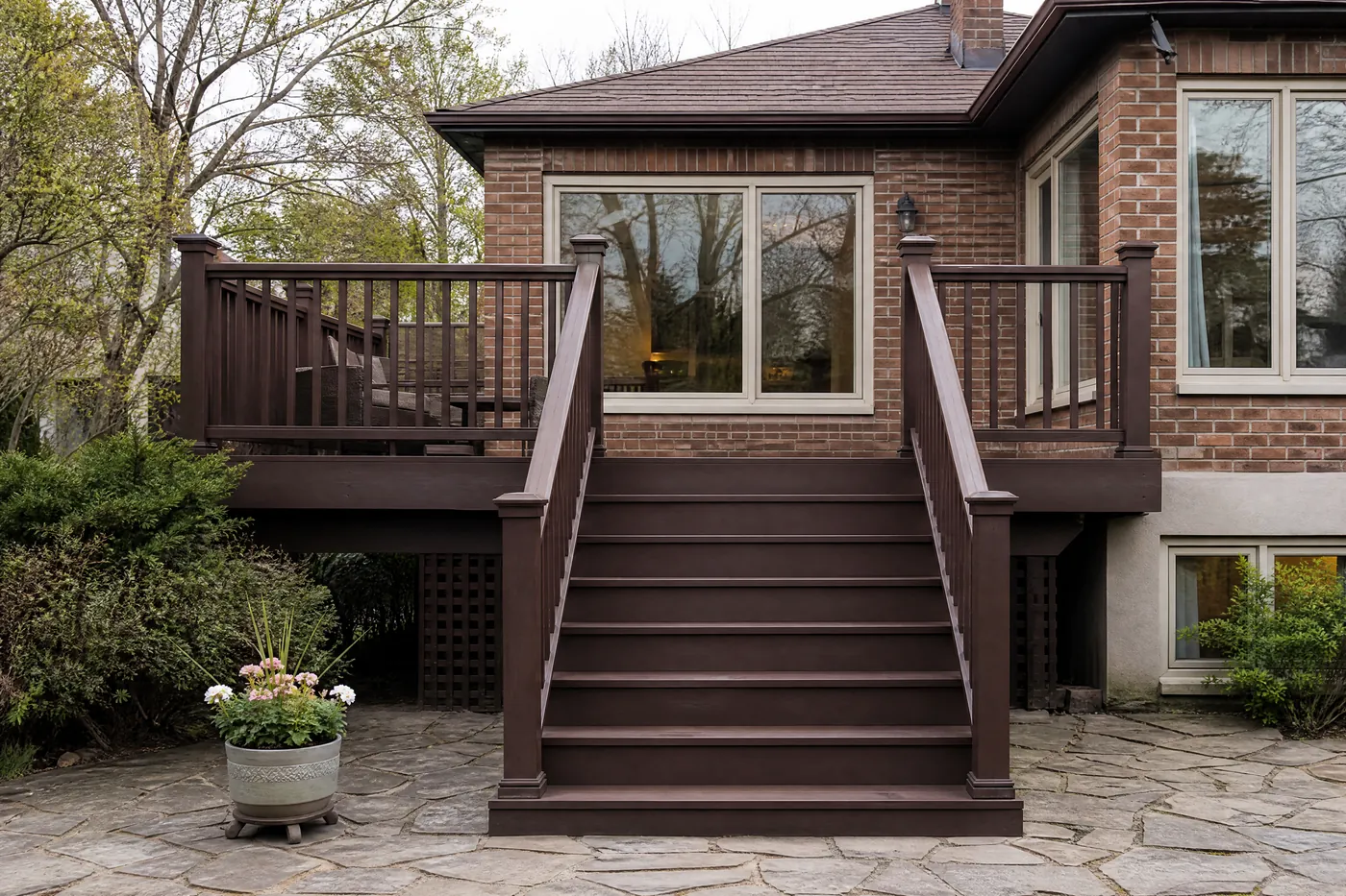 Deck stairs and railing freshly stained solid dark brown